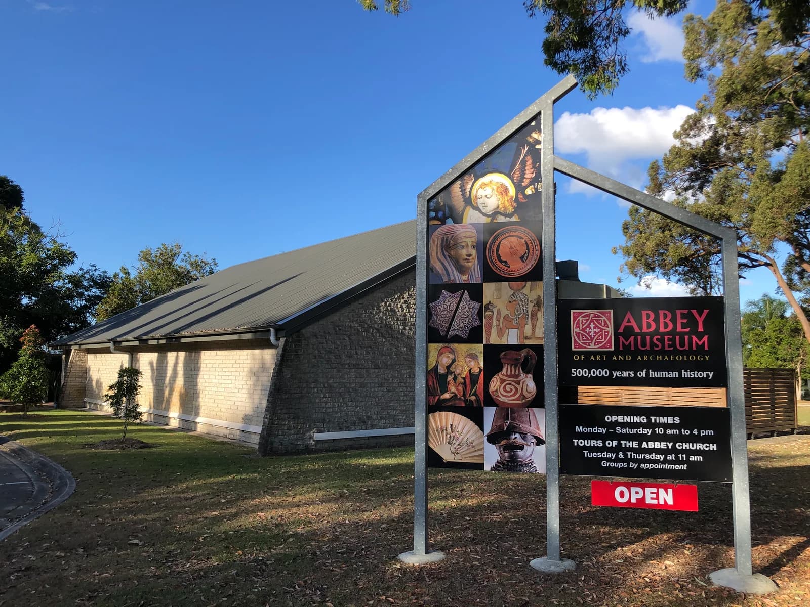 The entrance and sign of the Abbey Museum of Art and Archaeology.