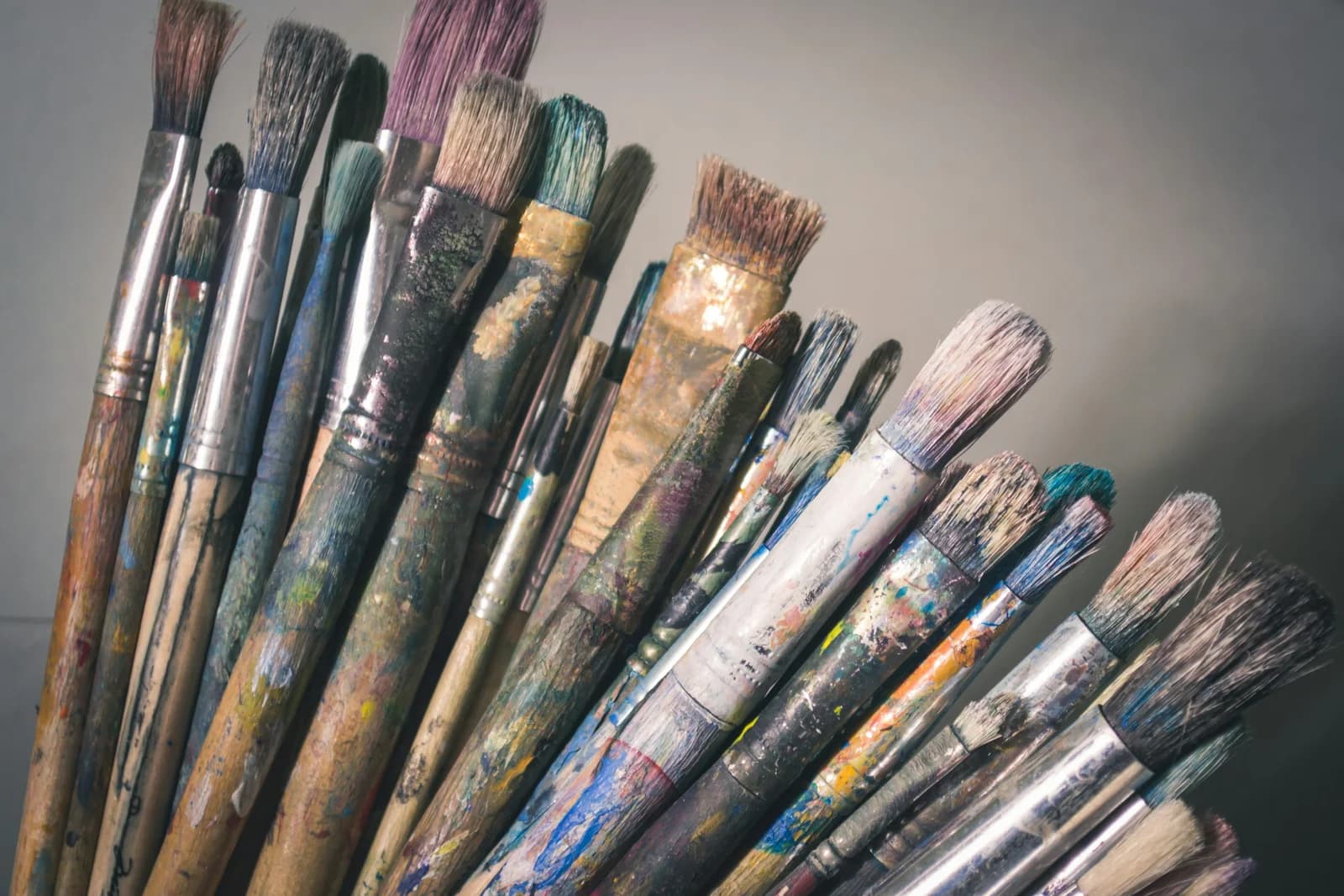 A collection of well-used artists’ paintbrushes.