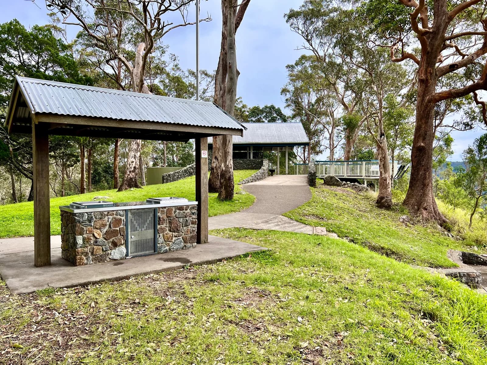 Picnic shelters beneath trees at Jollys Lookout.