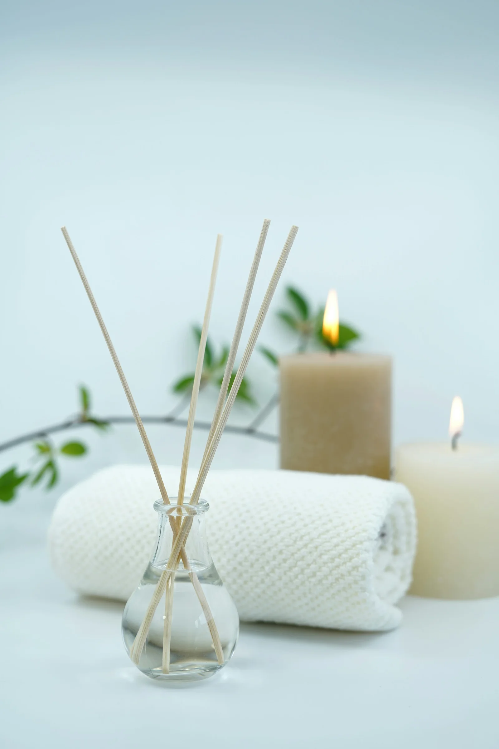 Candles, towels and a reed diffuser.