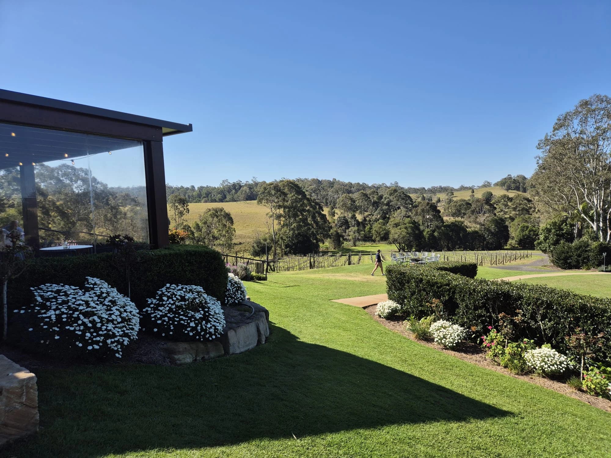 Landscaped gardens and countryside beside the Ocean View Estates building.