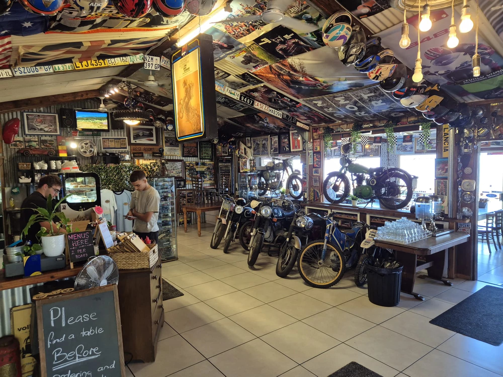 A panoramic view towards Dayboro from Pit Stop Cafe with an orientation board in the foreground.